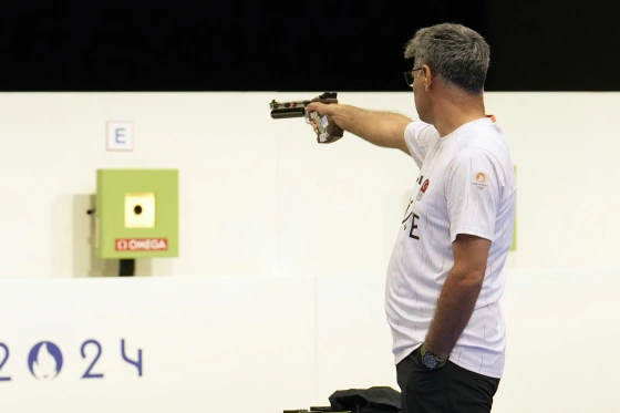 Turkey's Yusuf Dikeç competes in the 10-meter air pistol mixed team gold medal event at the Olympics in Chateauroux, France, on Tuesday.